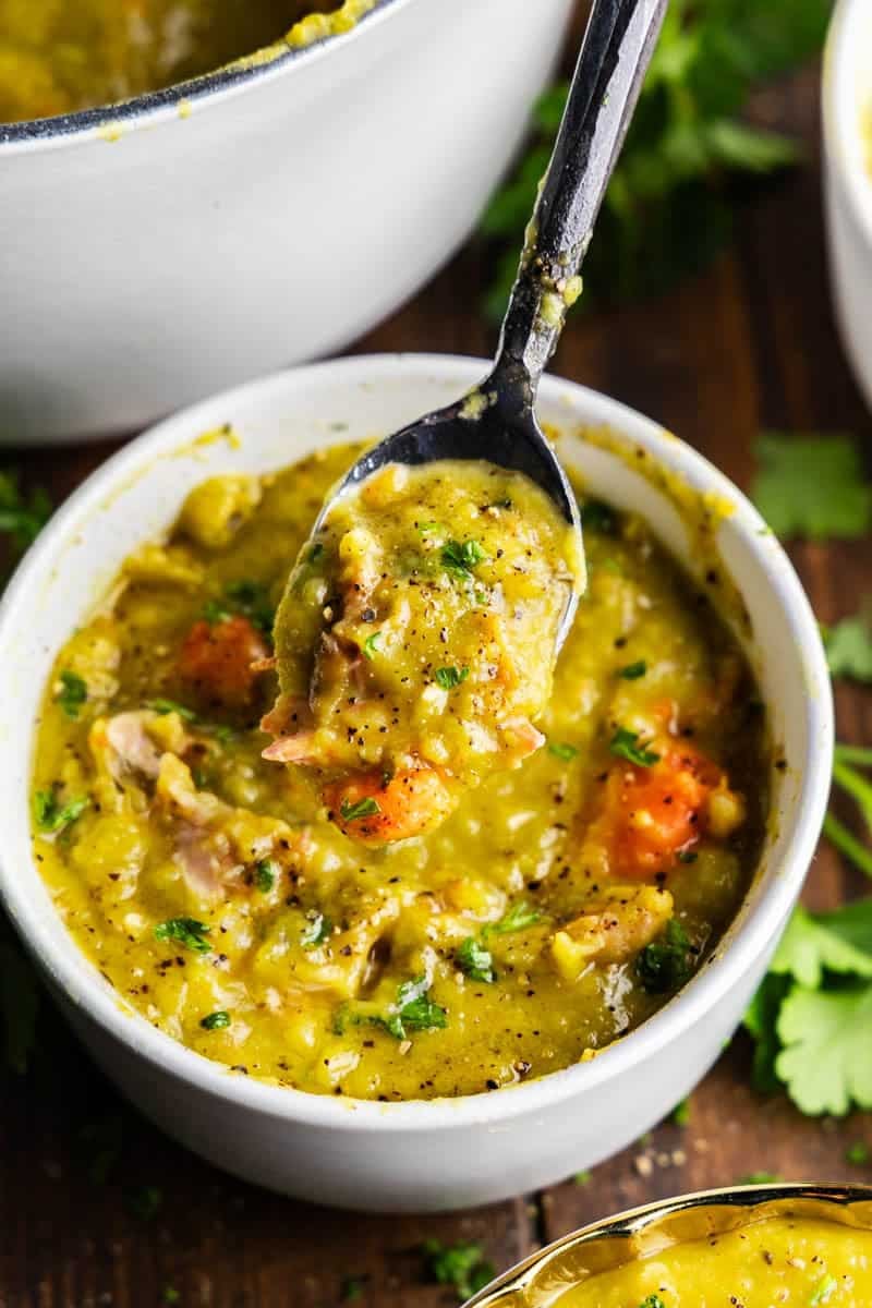 Shot of Split Pea Soup in bowl with spoon full.