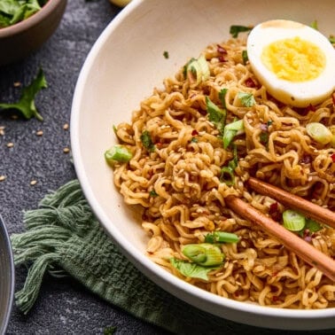 15 Minute Sriracha Ramen Noodles with soft boiled eggs and chopsticks.