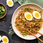 15 Minute Sriracha Ramen Noodles with soft boiled eggs and chopsticks.