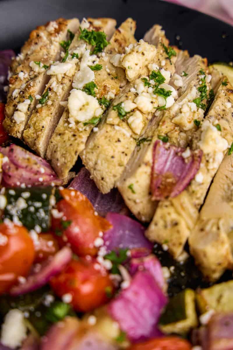 Air Fryer Greek Chicken & Veggies on a plate.