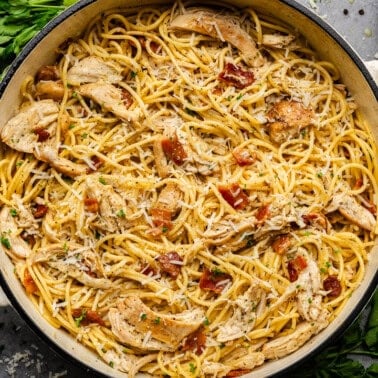 Overhead shot of chicken carbonara in cast iron pot.