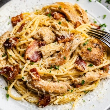 Closeup shot of chicken carbonara on a plate.