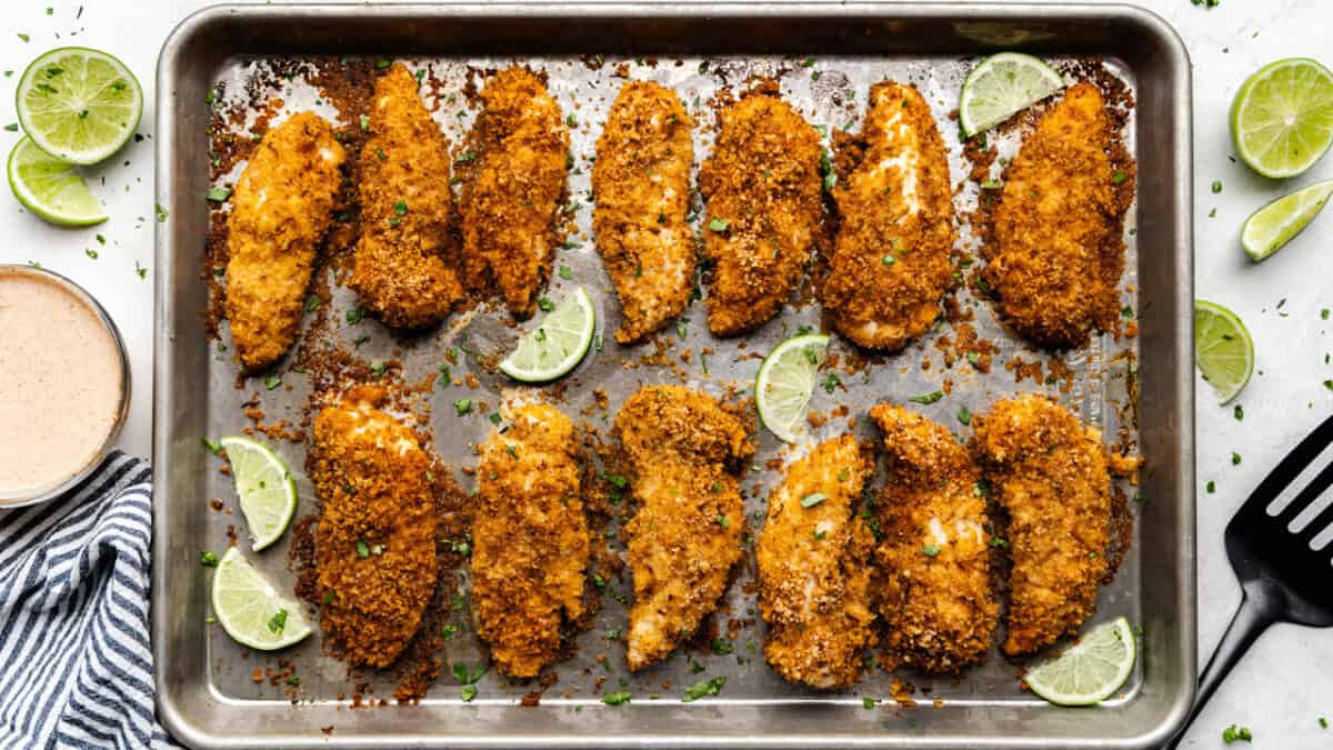 Chili-Lime Baked Chicken Tenders on a sheet pan.
