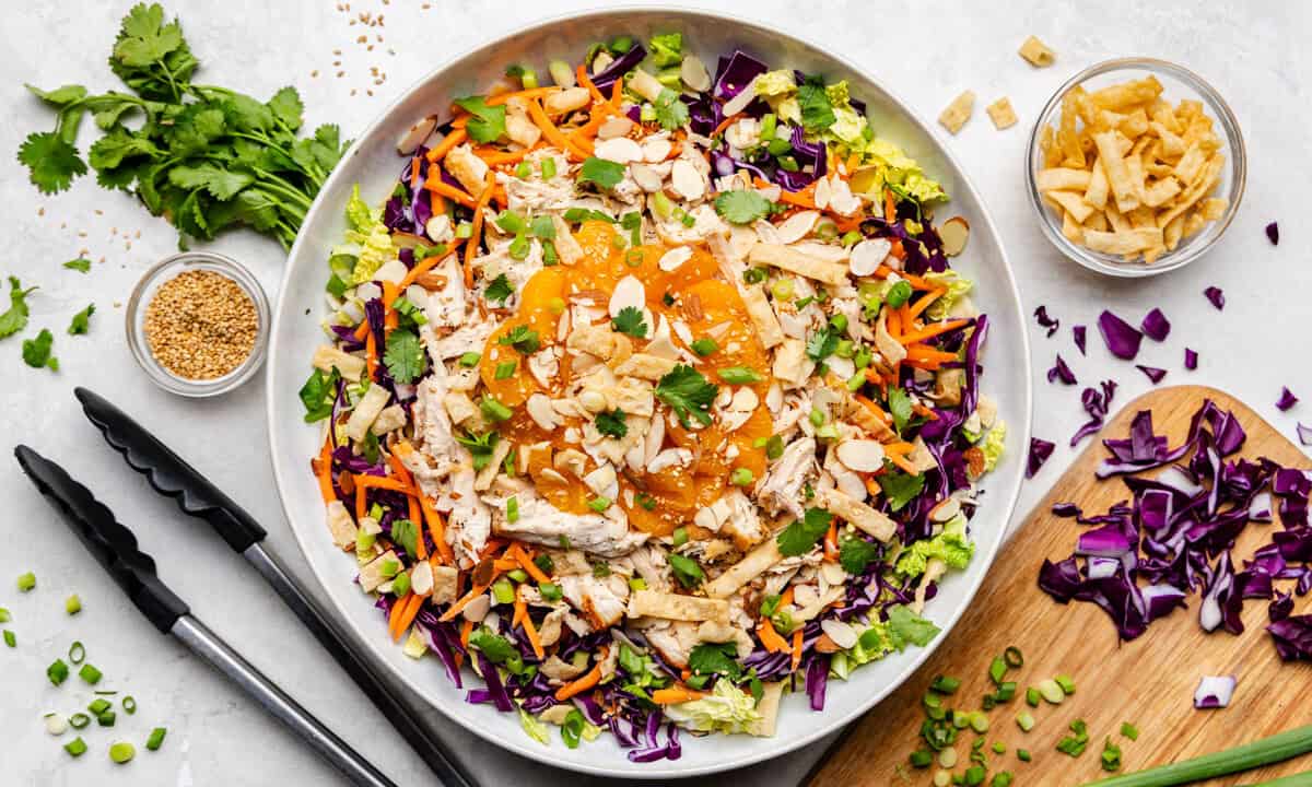 Overhead shot of Chinese Chicken Salad before it's been mixed in a large bowl.