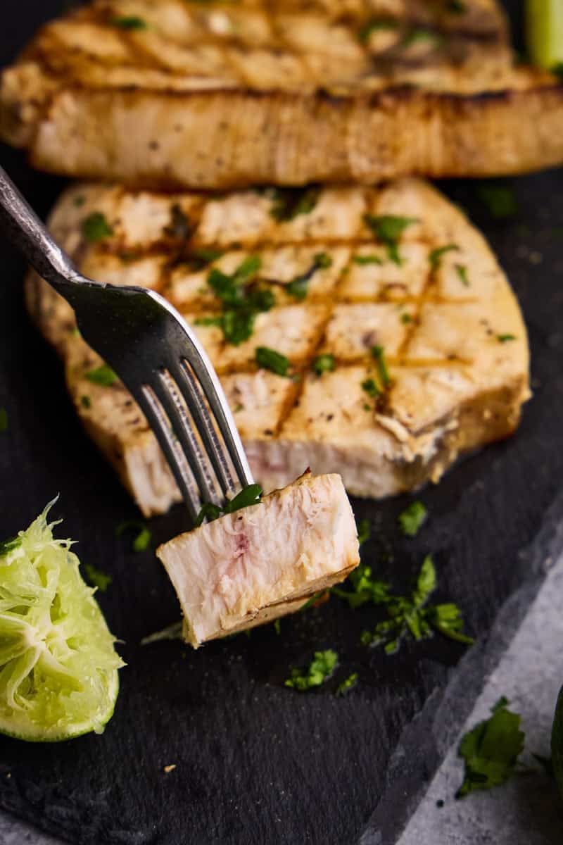 A bite Cilantro-Lime Grilled Swordfish on a fork.