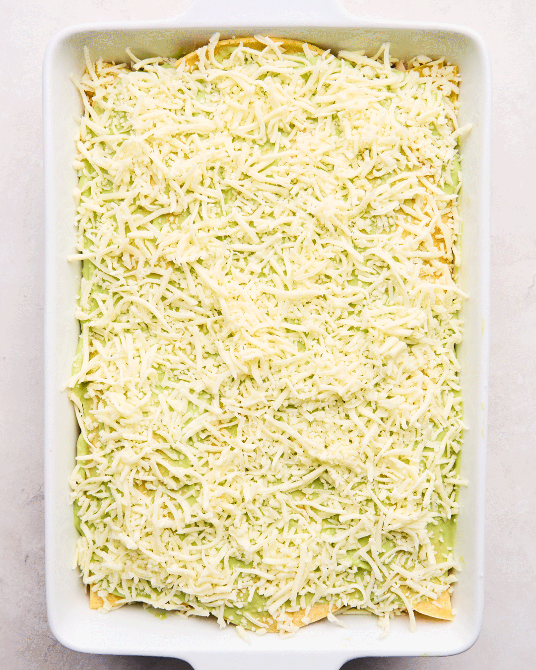 A Gif of the ingredients for Creamy Chicken Enchilada Casserole being put together.