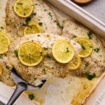 Easy Lemon Garlic Baked Tilapia on a spatula.