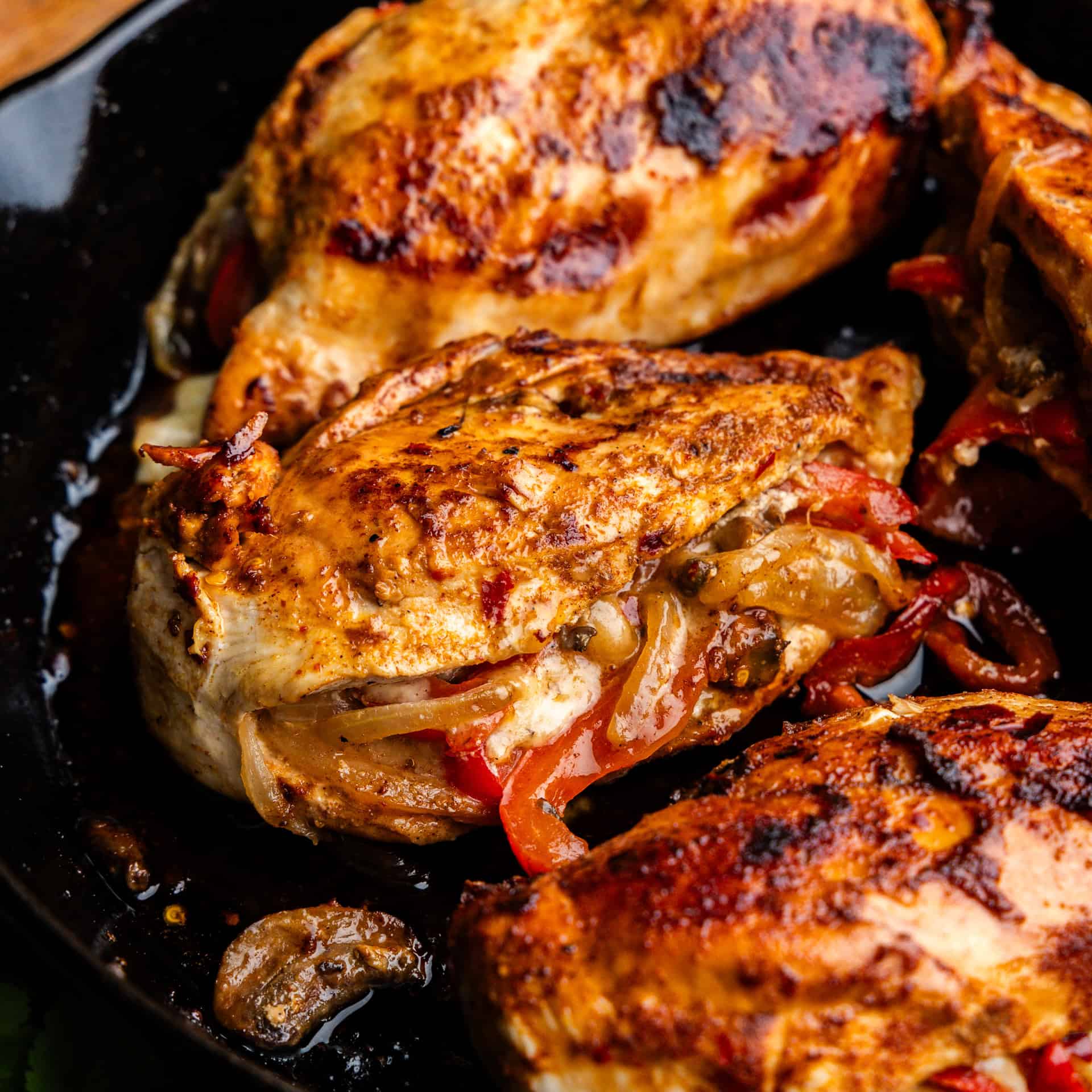 Closeup of Fajita Stuffed Chicken on a skillet.