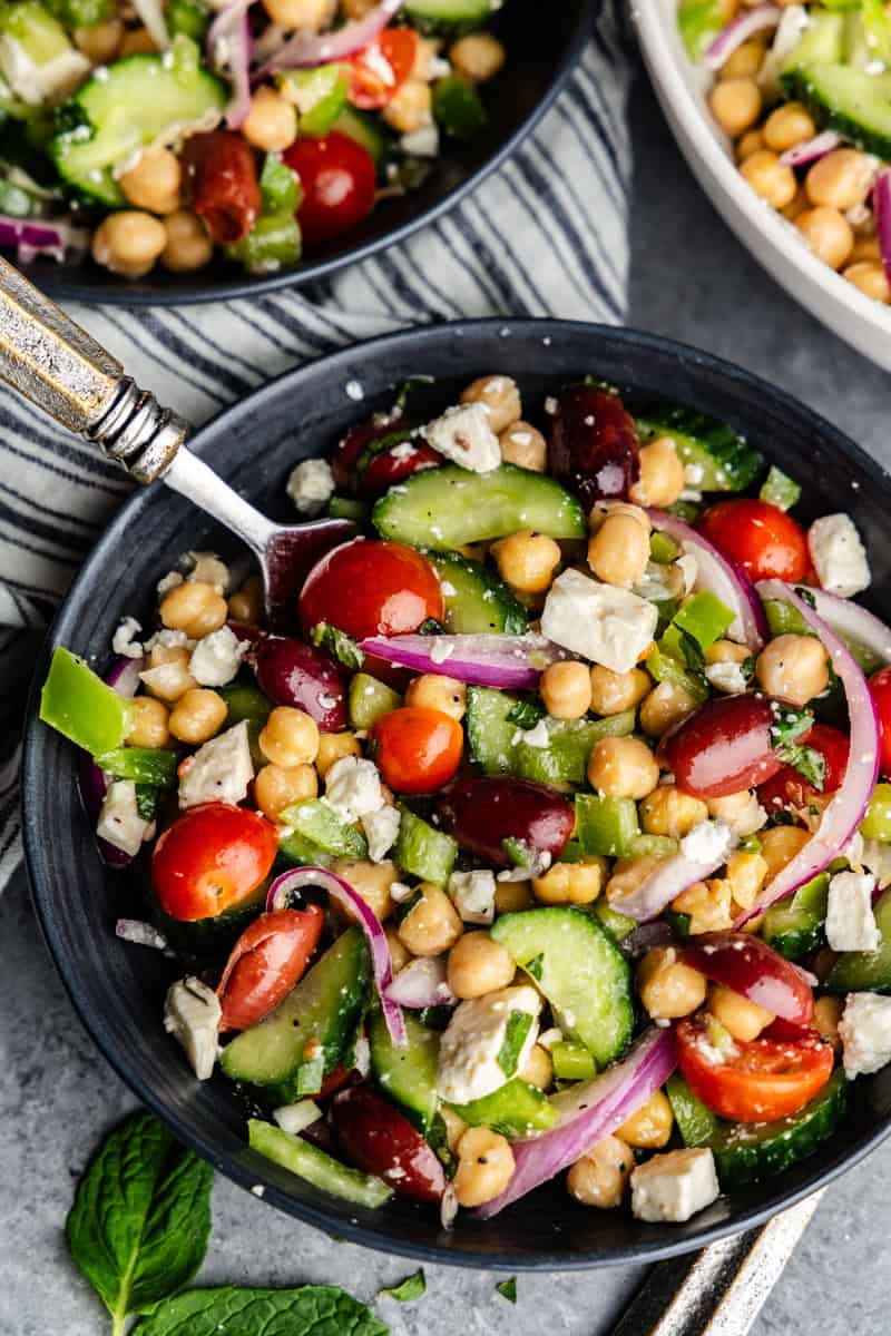 Overhead of Chickpea salad in multiple bowls.