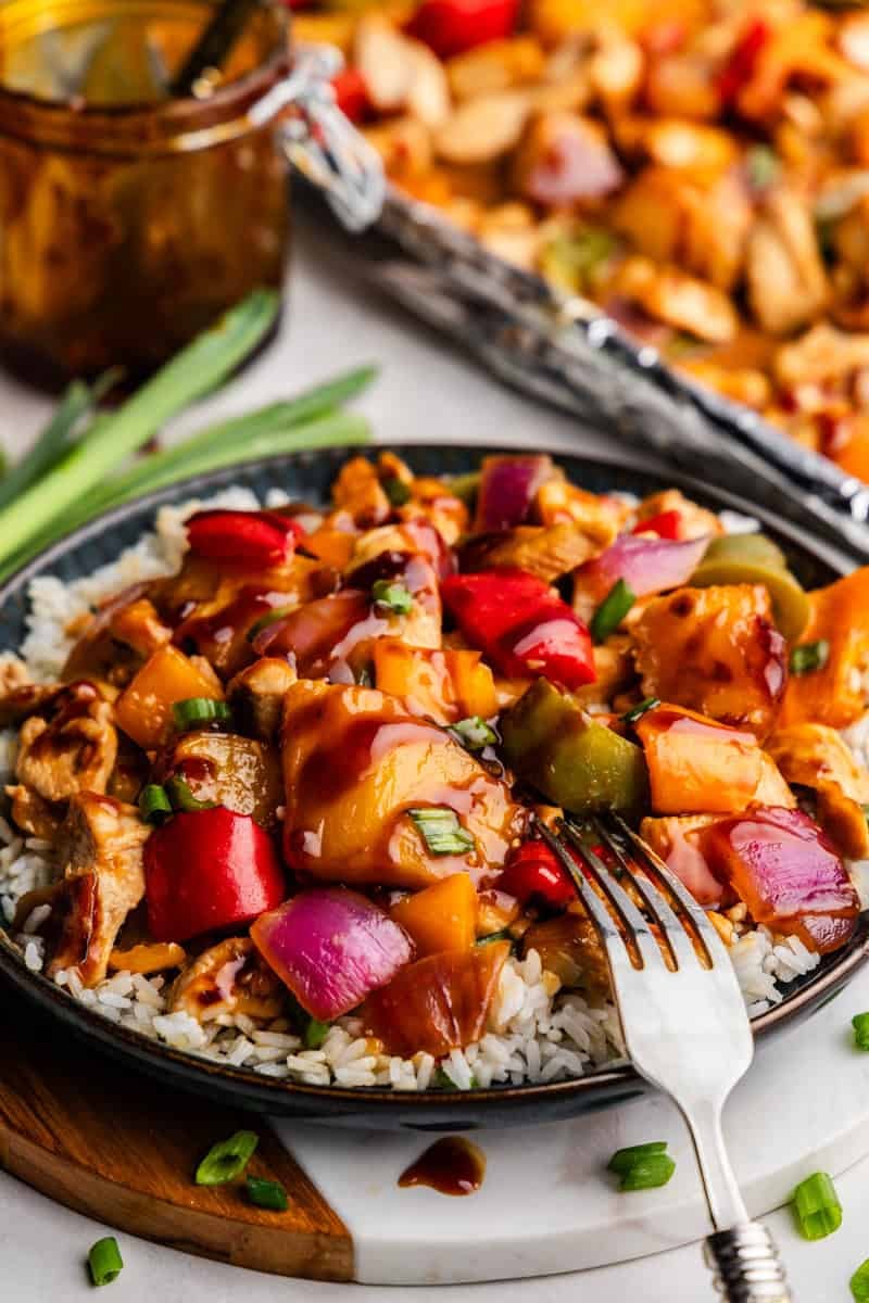 Closeup of Hawaiian Chicken & Veggies on a plate of rice.