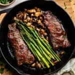 Overhead closeup of steak dinner in a skillet.