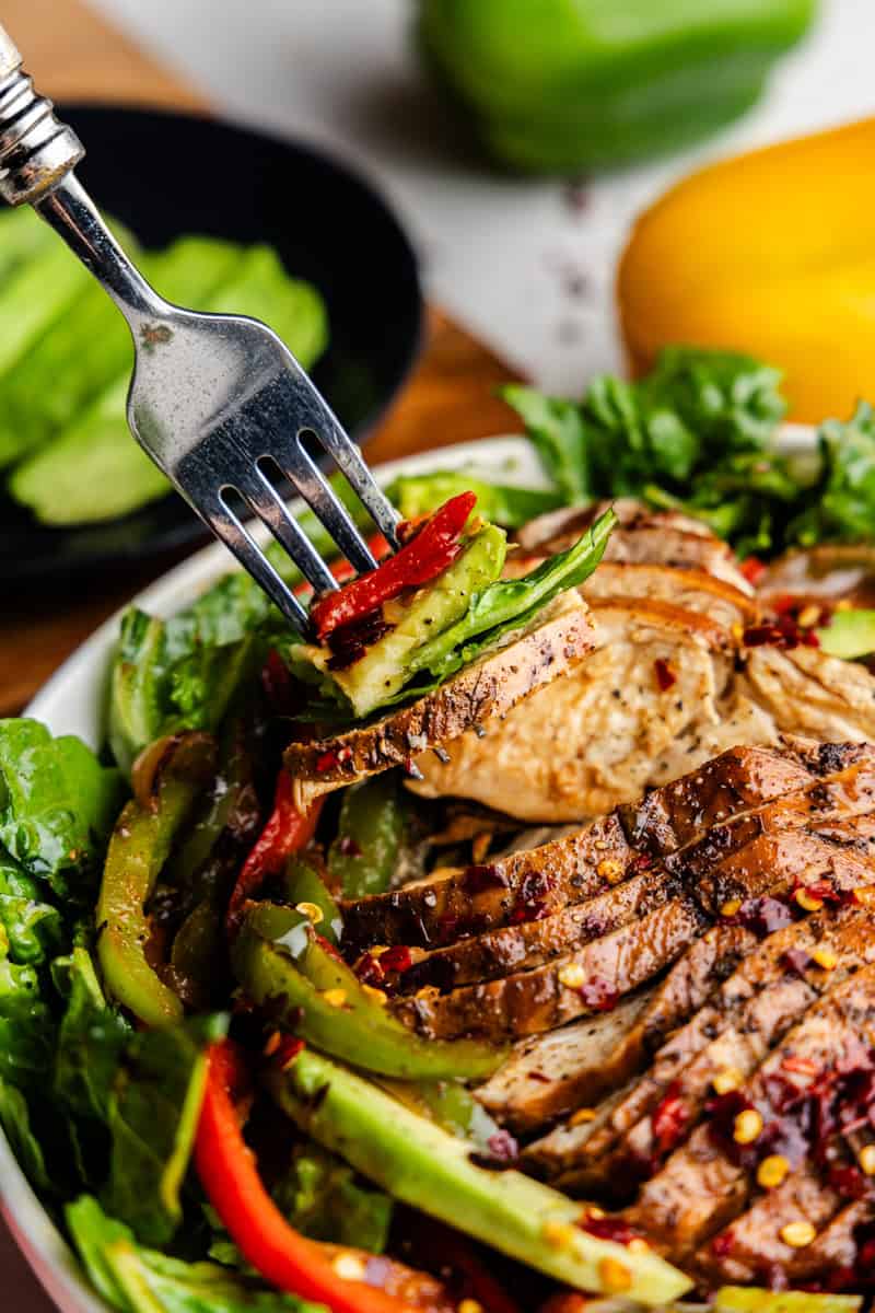 Closeup of the skinny chicken fugita salad with thorns bite.