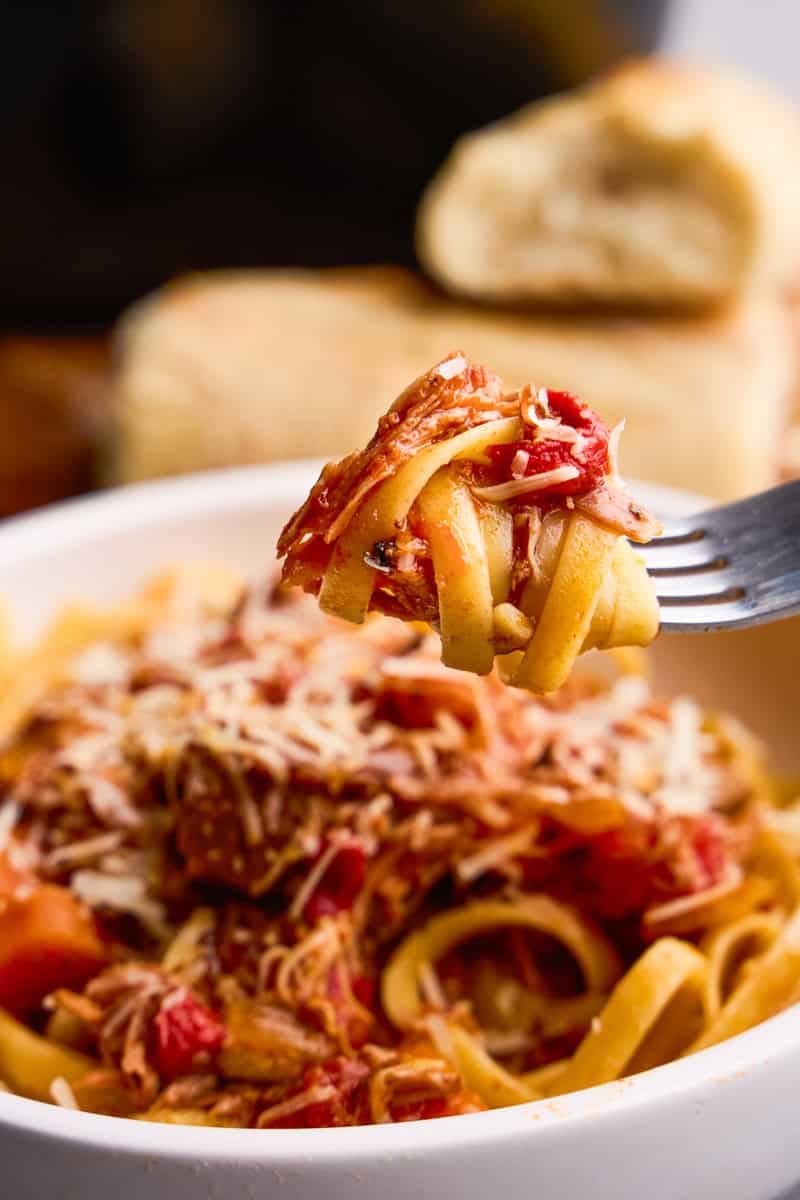 A forkful of Slow Cooker Pork Ragu and noodles.