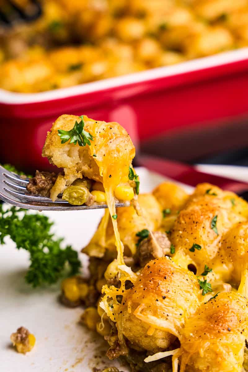 A bite of Tasty Tater Tot Casserole on a fork.