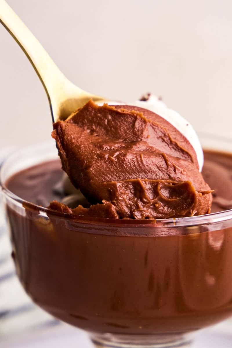 A spoon taking a scoop of 5 Ingredient Homemade Chocolate Pudding.
