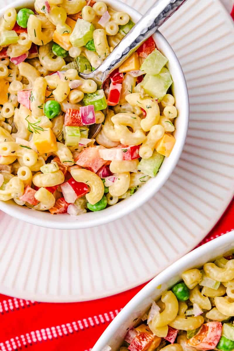 Best Macaroni Salad in a bowl with a spoon.