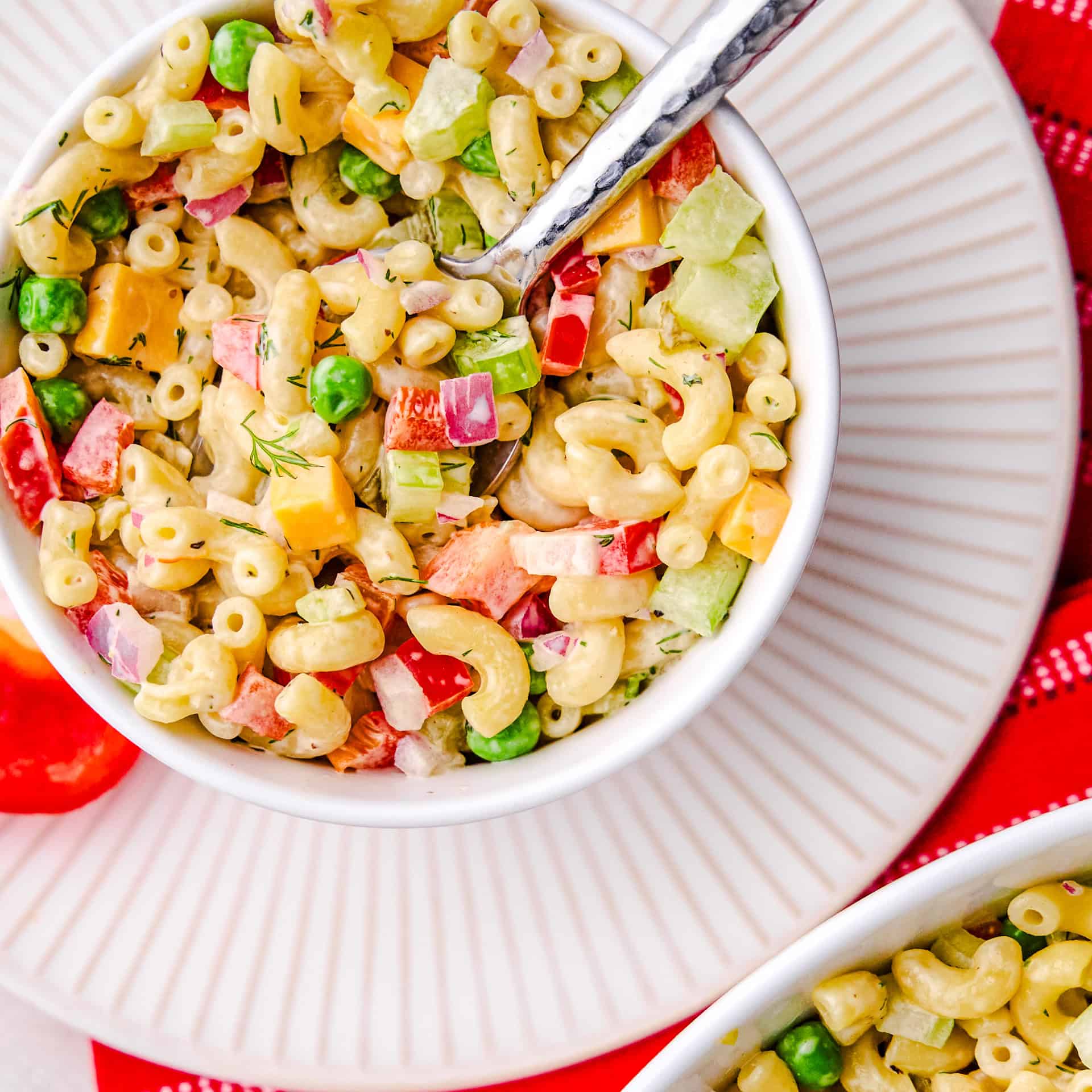 Best Macaroni Salad in a bowl with a spoon.
