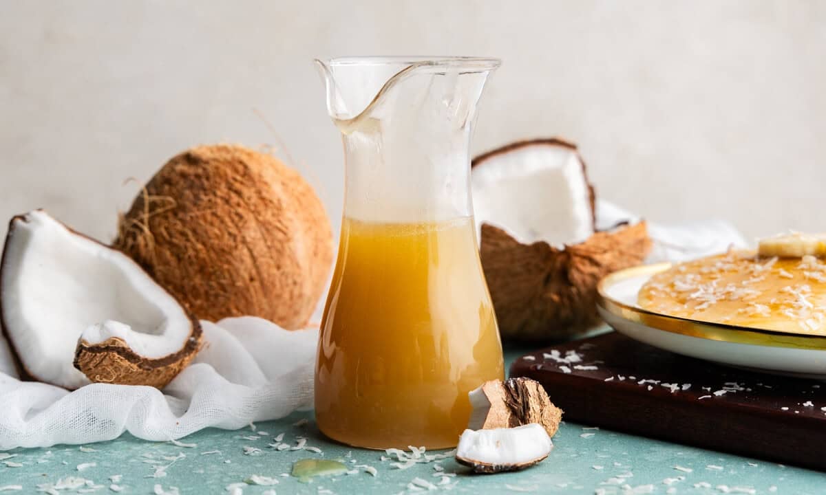 Coconut syrup in a pitcher.