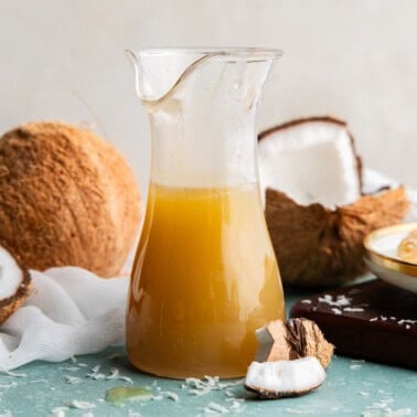 Coconut syrup in a pitcher.