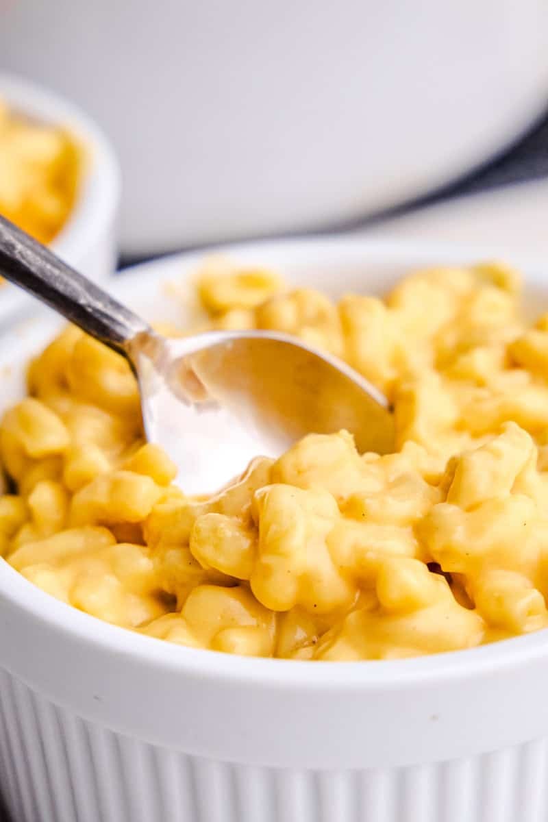 A spoon in a bowl of creamy Easy Stovetop Mac and Cheese.