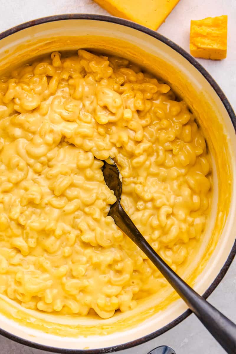 An overhead image of creamy Easy Stovetop Mac and Cheese in a cast iron pan.