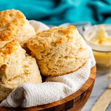 Flaky biscuits piled in a bowl.
