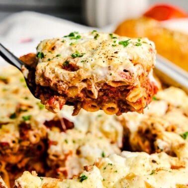 A Slice of the Best Baked Ziti Ever on a spatula.