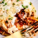A closeup image of a Slice of the Best Baked Ziti Ever with a fork.
