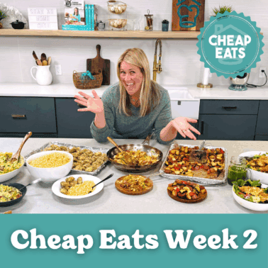 A photo of Chef Cayt in The Stay At Home Chef Kitchen with the meals from Week 2 of the Cheap Eats Meal plan on display on the kitchen counter.