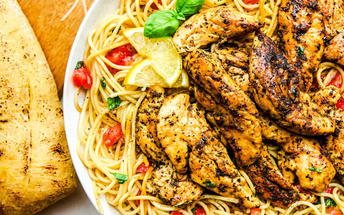 Lemon Herb Chicken Spaghetti with tomatoes and basil.
