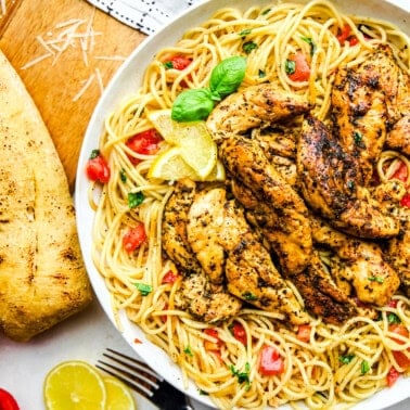Lemon Herb Chicken Spaghetti with tomatoes and basil.
