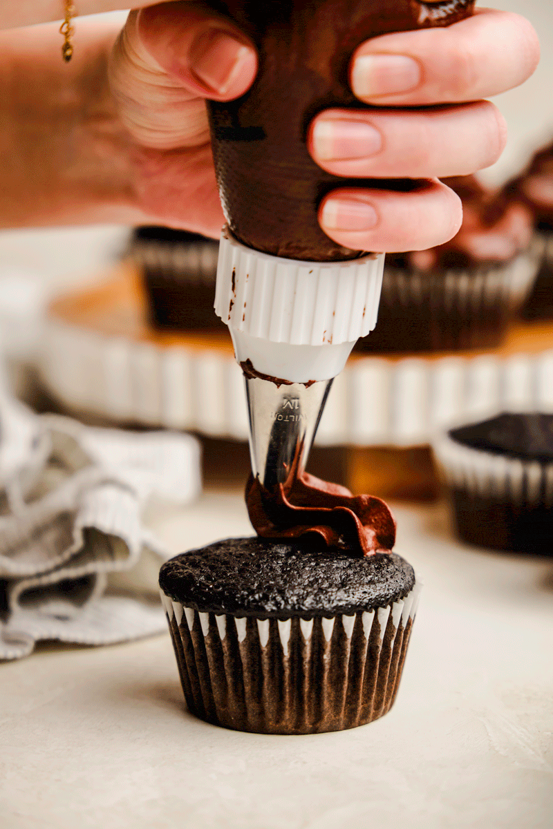 A gif of chocolate frosting being put onto the Most Amazing Chocolate Cupcake Recipe.