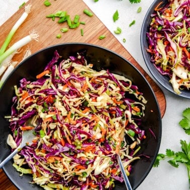 Spicy Sesame Coleslaw in a black serving bowl.