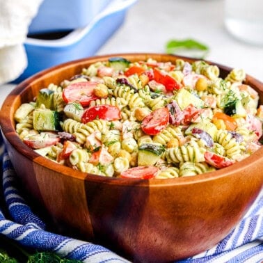 Whipped Feta Greek Pasta Salad in a large wooden serving bowl.