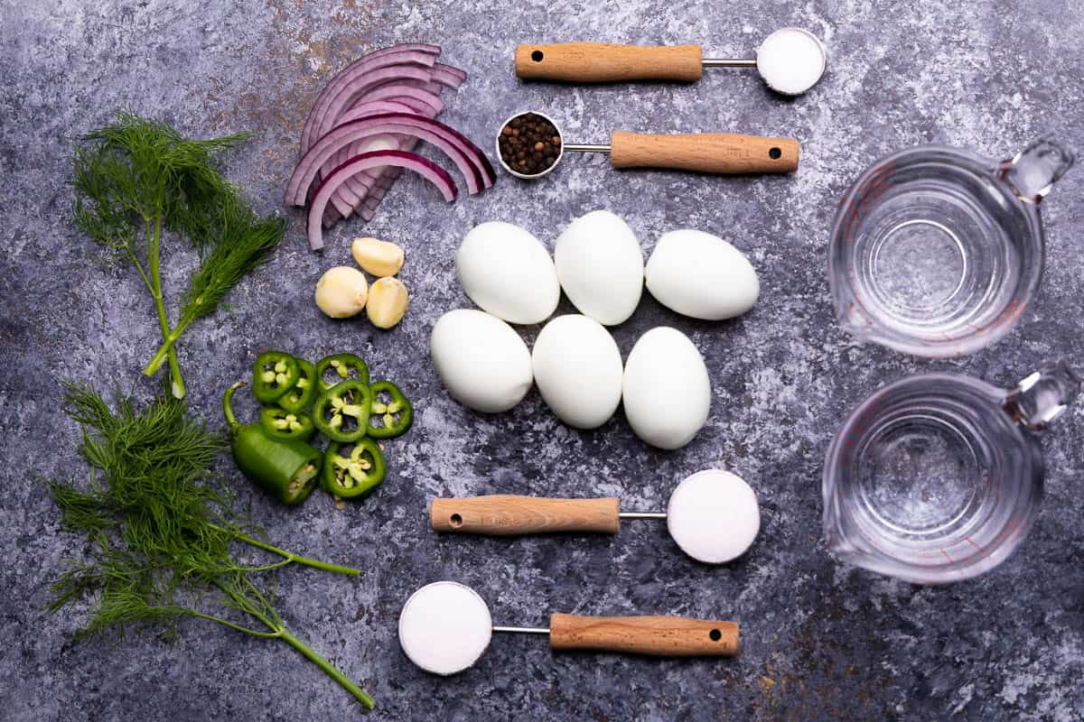 An overhead view of the ingredients needed to make homemade pickled eggs.
