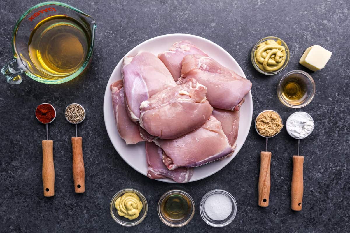An overhead view of the ingredients needed to make apple cider glazed chicken thighs.
