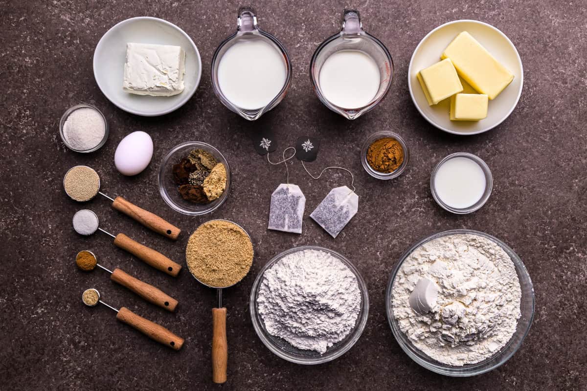 An overhead view of the ingredients needed to make chai latte cinnamon rolls.