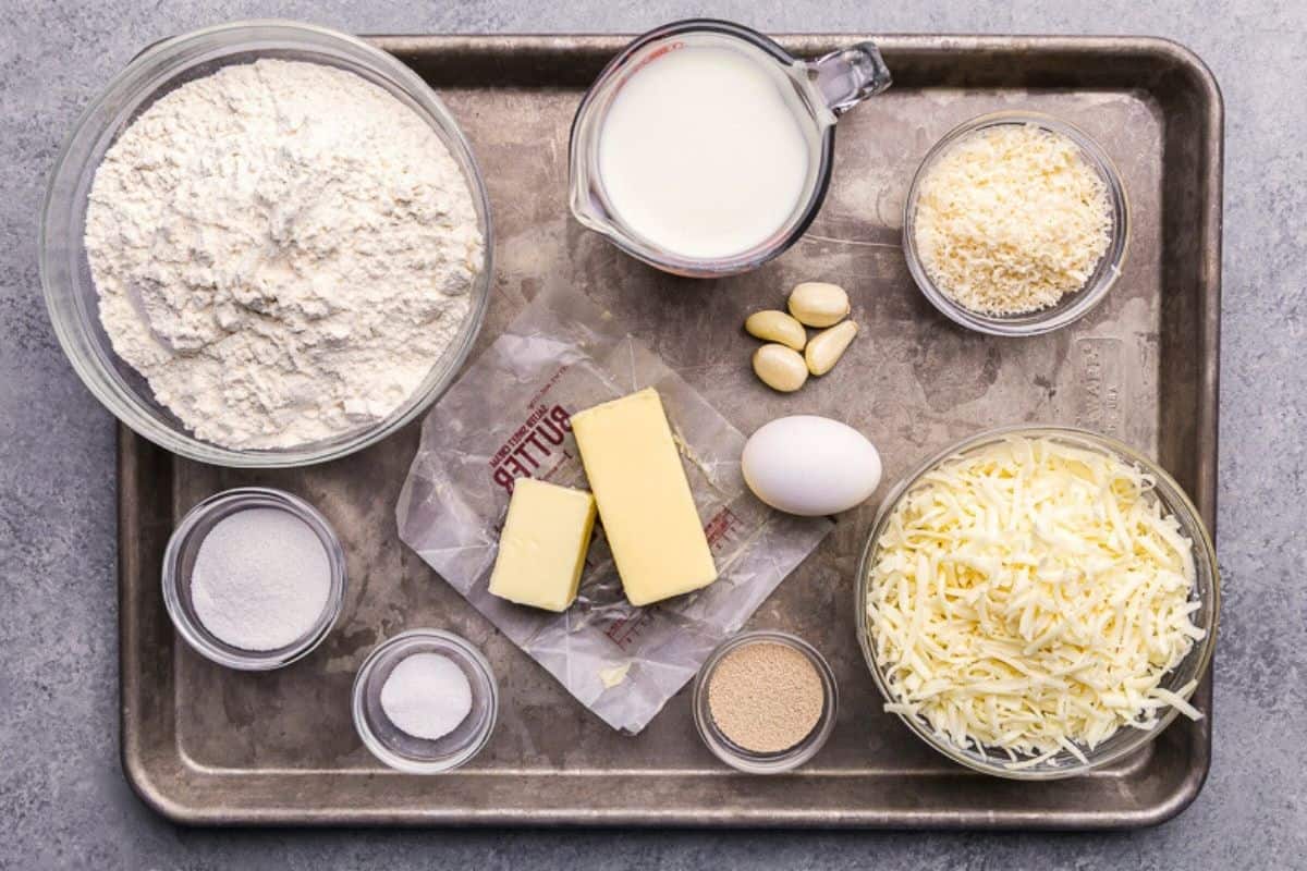 An overhead view of the ingredients needed to make cheesy garlic butter pull apart rolls.