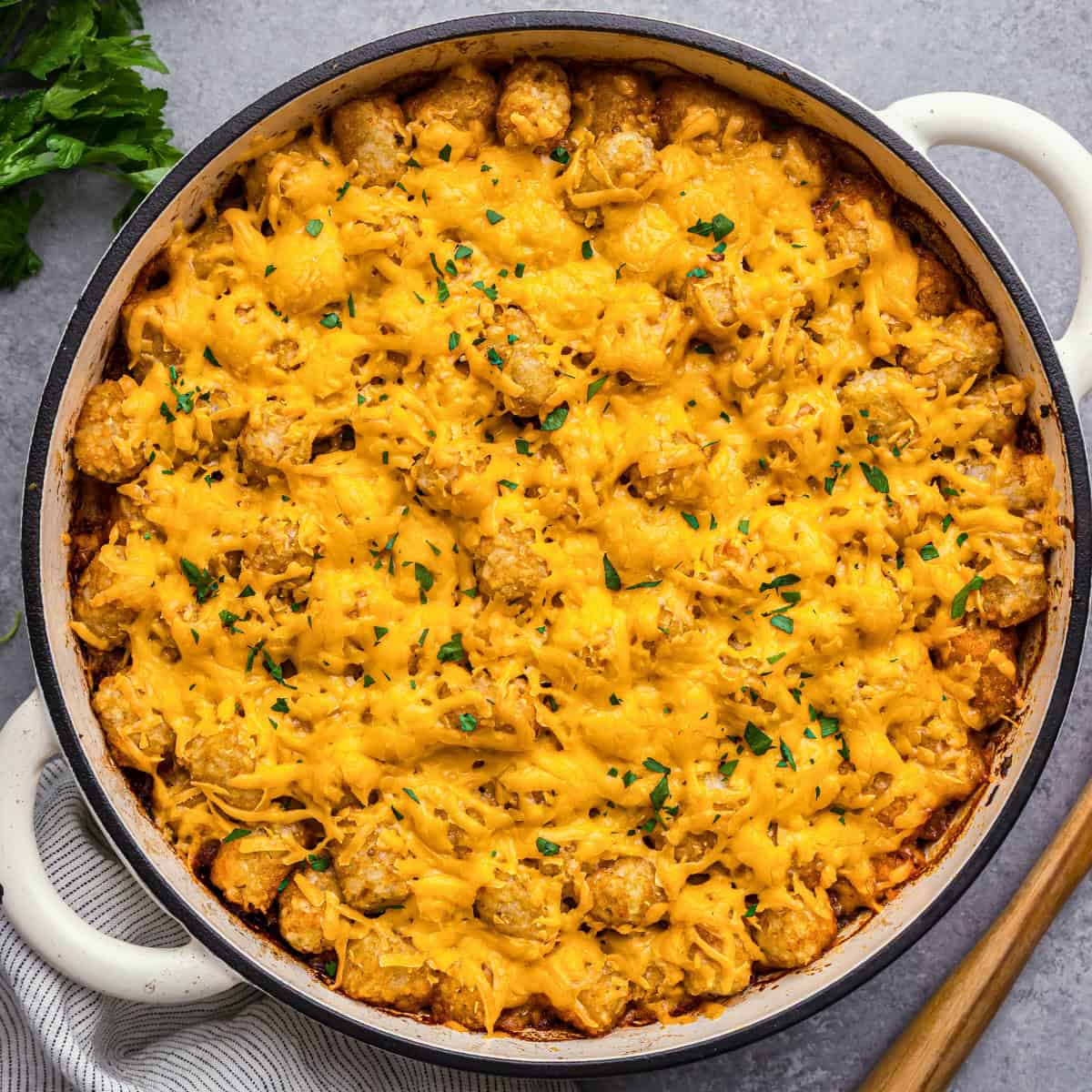 An overhead view of sloppy joe tater tot casserole in a casserole dish.